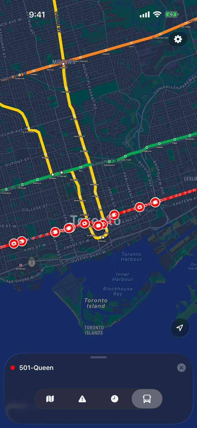 501 Queen streetcars shown as red markers along Queen Street on a dark map of downtown Toronto.